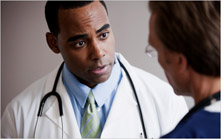 African-American Healthcare Professional Talking with White Male Patient